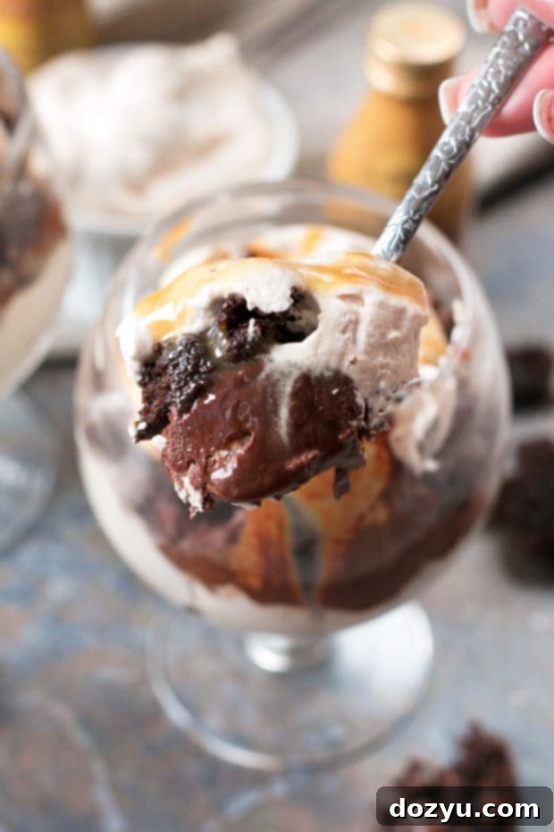 Close-up of a single Bailey's Chocolate Mousse Brownie Parfait garnished with chocolate shavings