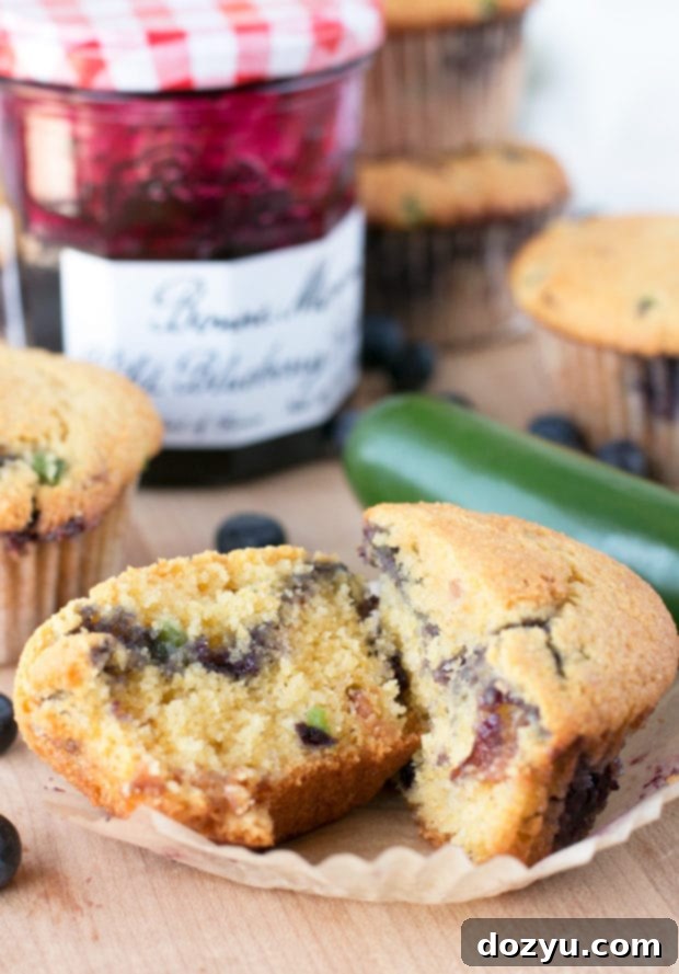 Cross-section of a Blueberry Jalapeño Bacon Cornbread Muffin, revealing pockets of Bonne Maman Wild Blueberry Preserves and bacon pieces