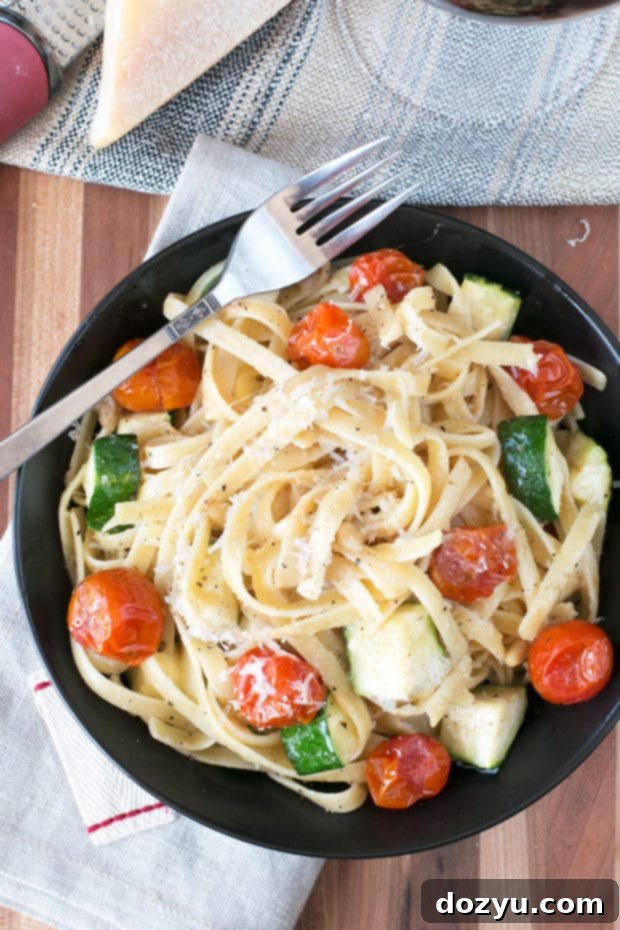 Close-up of Brown Butter Spring Vegetable Fettuccine with roasted tomatoes and zucchini