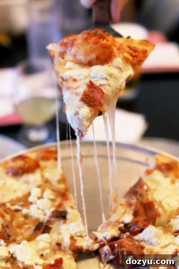 A selection of craft beers on tap and a delicious pizza at Hops & Pie in Denver's Tennyson Street neighborhood