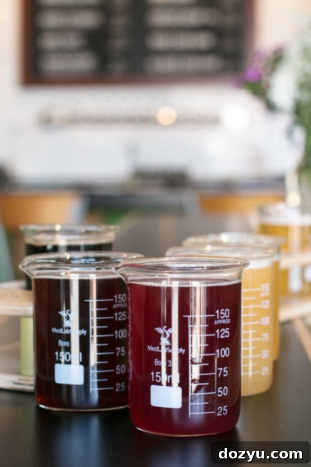 Various craft beers served in beakers at Cerebral Brewing in Denver, emphasizing their science-meets-beer approach