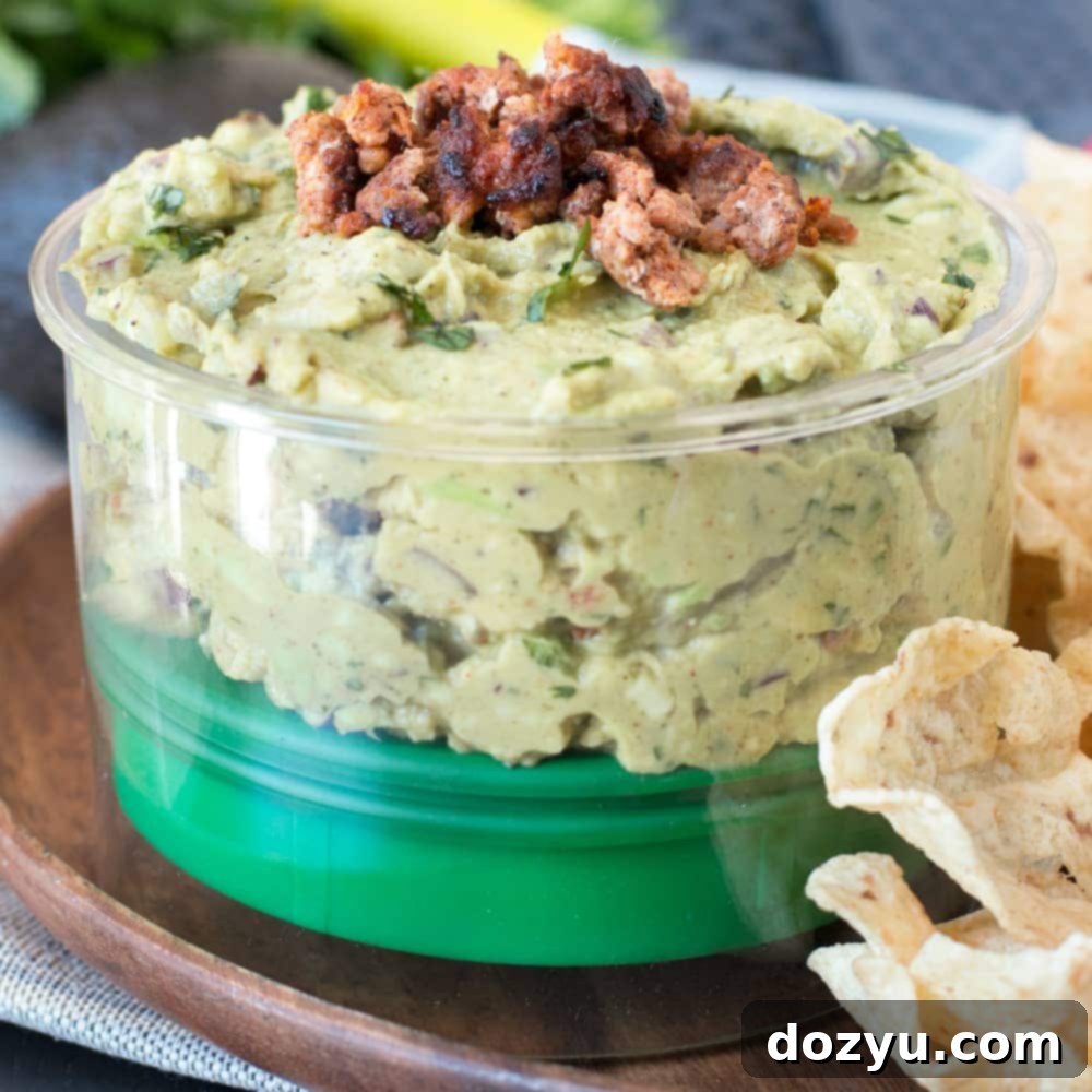 A vibrant bowl of Chipotle Chorizo Guacamole, ready to be served.