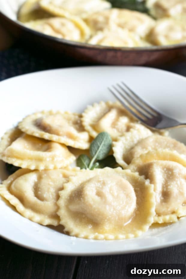 Autumn Pumpkin Pillows with Aromatic Sage Butter 3 Freshly made pumpkin ricotta ravioli on a cutting board