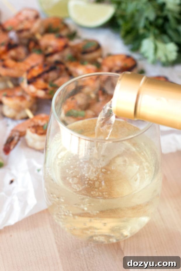 Mango Garlic Shrimp Skewers with Spicy Cilantro Dipping Sauce | cakenknife.com #21andup @CavitWines