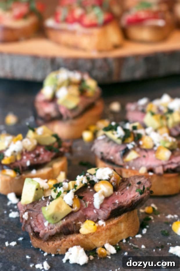 Grilled Steak and Corn Crostini with cotija cheese and avocado, a hearty appetizer
