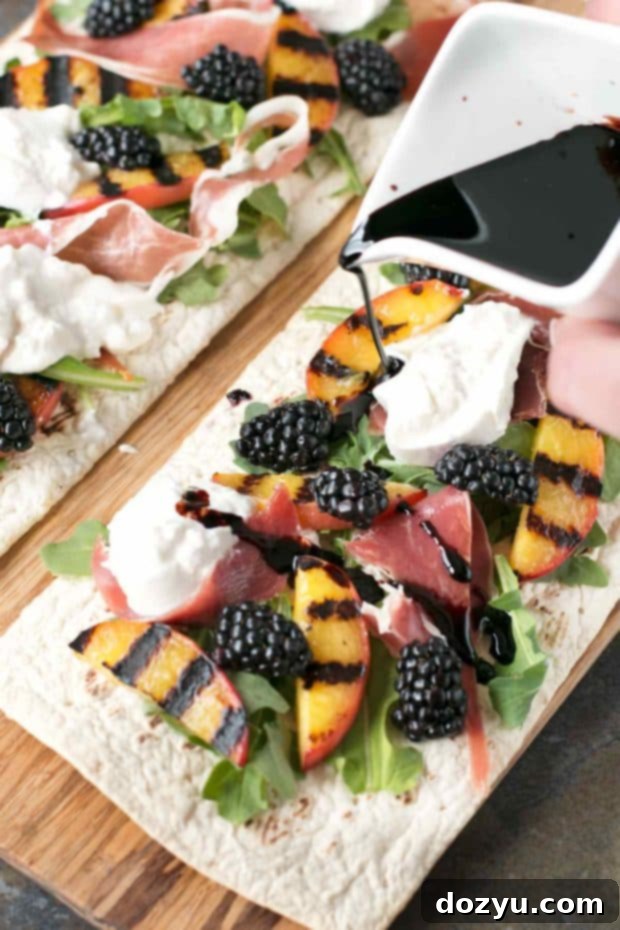Top-down view of grilled peach and prosciutto flatbread slices