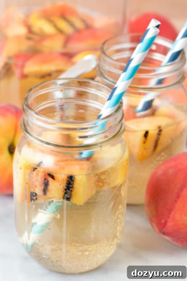 Sparkling Grilled Peach Sangria | cakenknife.com #grilling #peaches #wine #cocktail