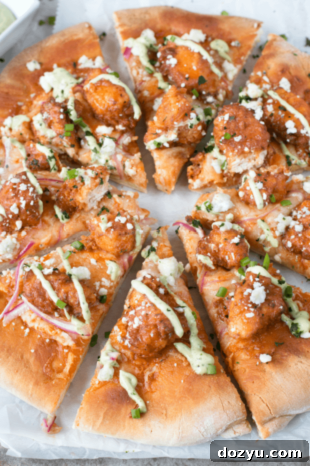 Buffalo Chicken Pizza with Blue Cheese Avocado Dressing | cakenknife.com #pizza #buffalochicken #chickenwings
