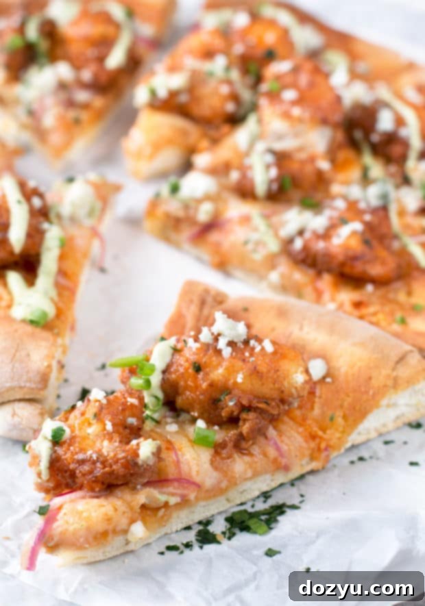 Buffalo Chicken Pizza with Blue Cheese Avocado Dressing | cakenknife.com #pizza #buffalochicken #chickenwings