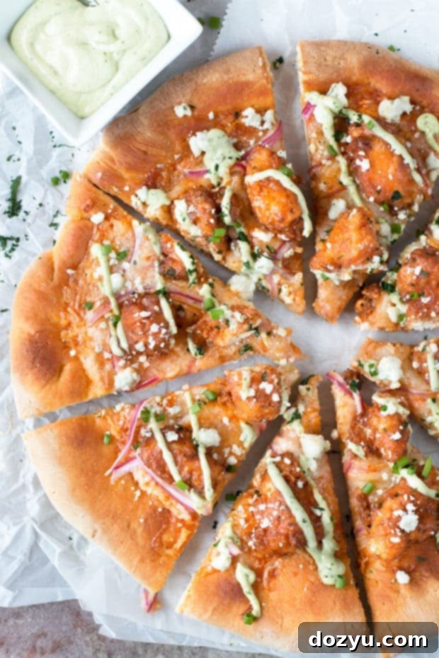 Buffalo Chicken Pizza with Blue Cheese Avocado Dressing | cakenknife.com #pizza #buffalochicken #chickenwings