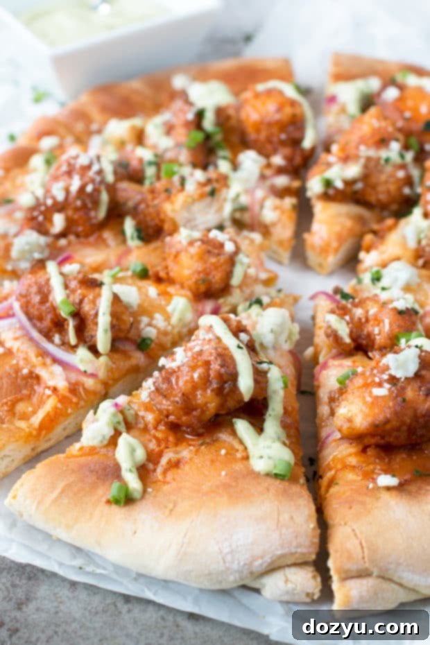 Buffalo Chicken Pizza with Blue Cheese Avocado Dressing | cakenknife.com #pizza #buffalochicken #chickenwings