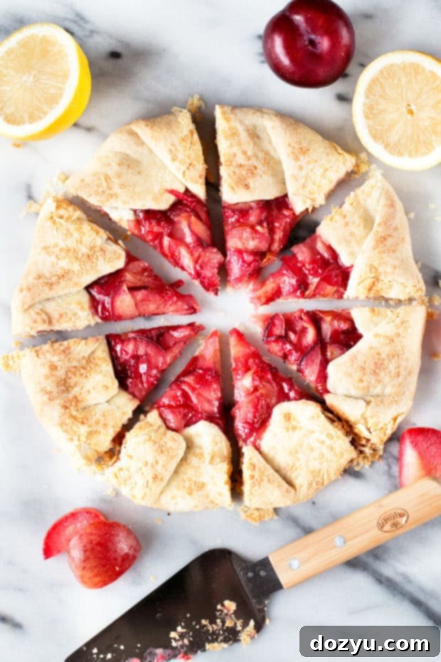 Close-up of a Rustic Pluot Lemon Galette, showing the vibrant pluot slices and golden crust.