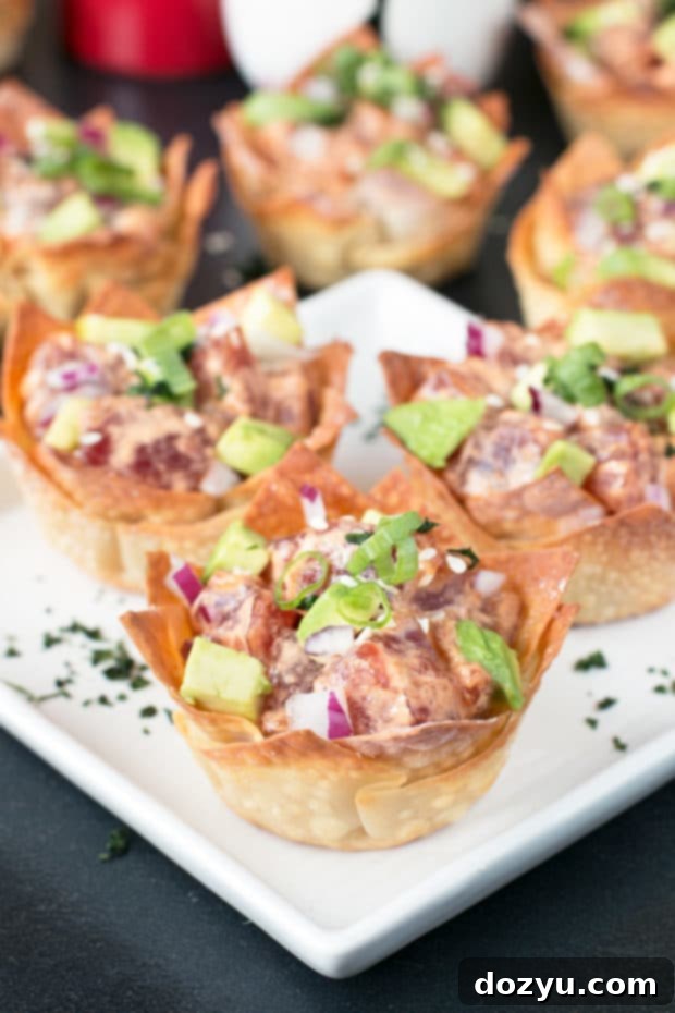 Chef preparing fresh Ahi tuna poke mixture in a bowl