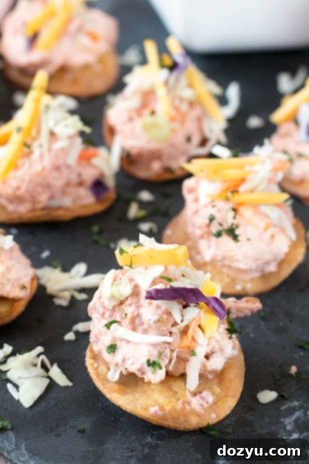 Bang Bang Shrimp Tostada Bites with Mango Slaw | cakenknife.com #appetizer #party #bangbangshrimp