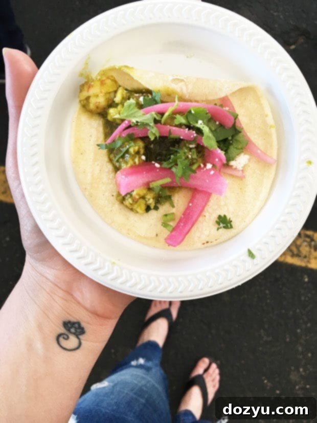 Enthusiastic attendees enjoying a wine tasting at the Denver Food + Wine Festival