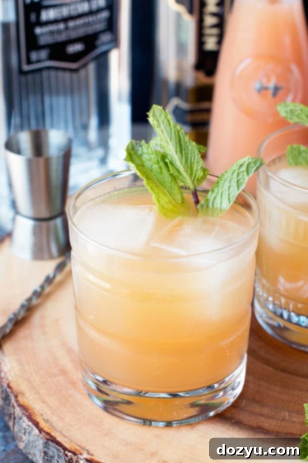 A glass of Elvis Cocktail with a mint garnish