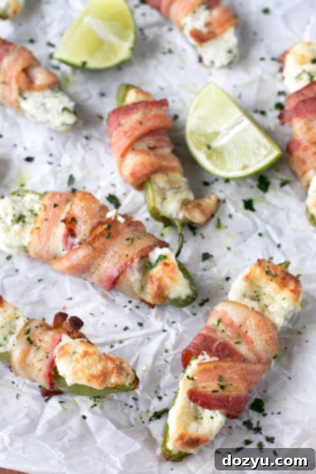 Goat Cheese Stuffed Bacon Wrapped Jalapeños | cakenknife.com #sponsored #goatcheese #tailgating