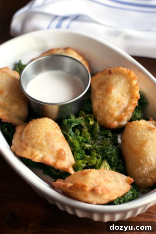 New Historic Arvada After Dark 16 Close-up of a sizzling Skillet Mac and Cheese with green chile