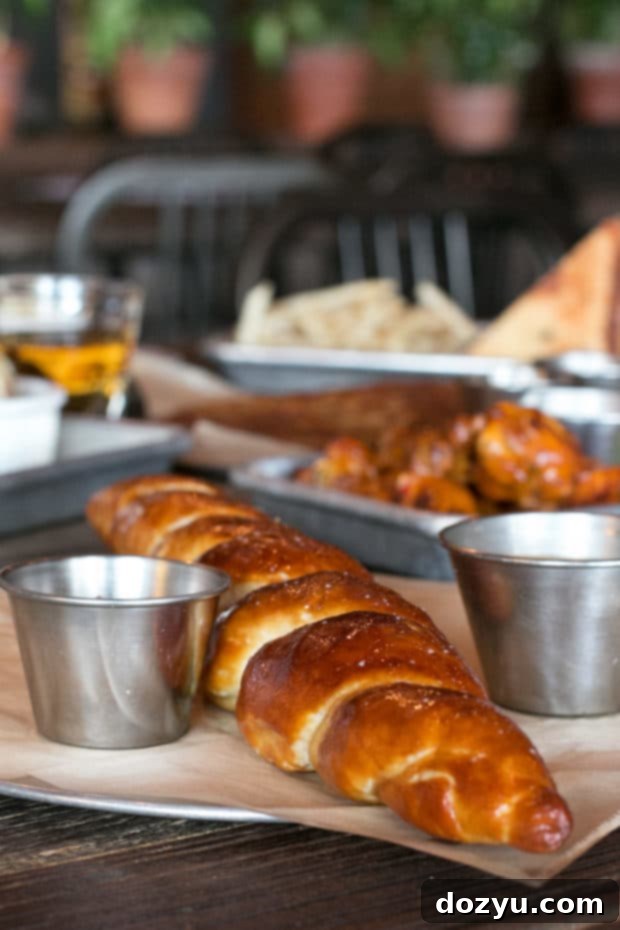 New Historic Arvada After Dark 8 Close-up of a delicious Bavarian pretzel with beer cheese and mustard