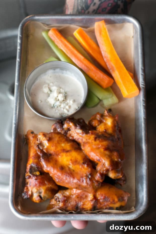 New Historic Arvada After Dark 9 Plate of perfectly grilled buffalo wings with sauce