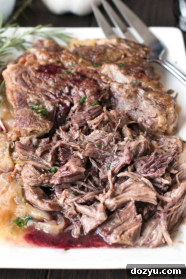 Slow Cooker Garlic Rosemary Pot Roast with Red Wine Sauce | cakenknife.com #ad #roastwiththemost #potroast #crockpot