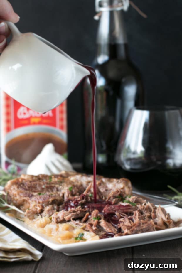 Slow Cooker Garlic Rosemary Pot Roast with Red Wine Sauce | cakenknife.com #ad #roastwiththemost #potroast #crockpot