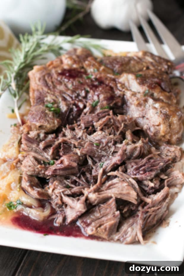 Slow Cooker Garlic Rosemary Pot Roast with Red Wine Sauce | cakenknife.com #ad #roastwiththemost #potroast #crockpot