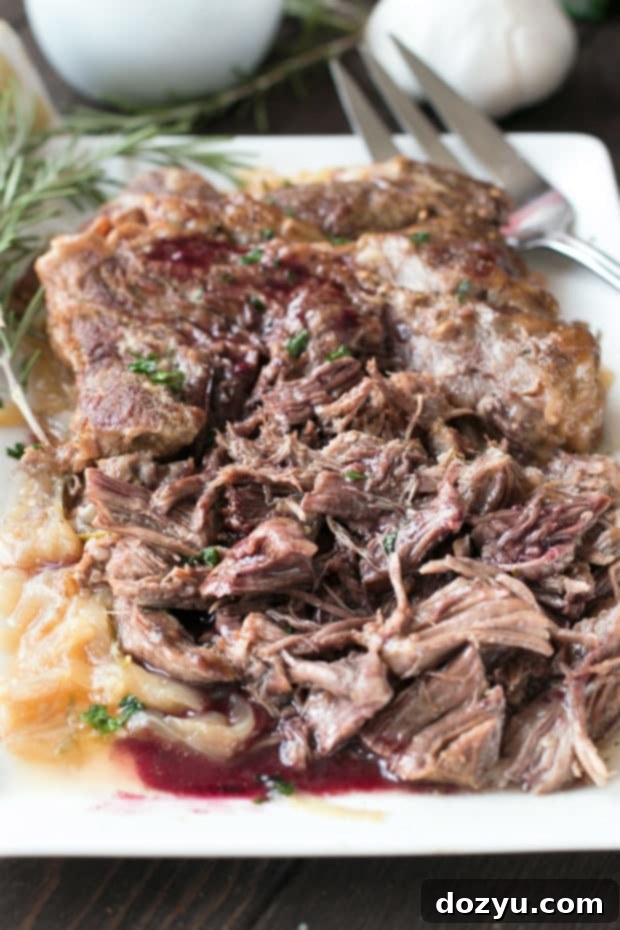 Slow Cooker Garlic Rosemary Pot Roast with Red Wine Sauce | cakenknife.com #ad #roastwiththemost #potroast #crockpot