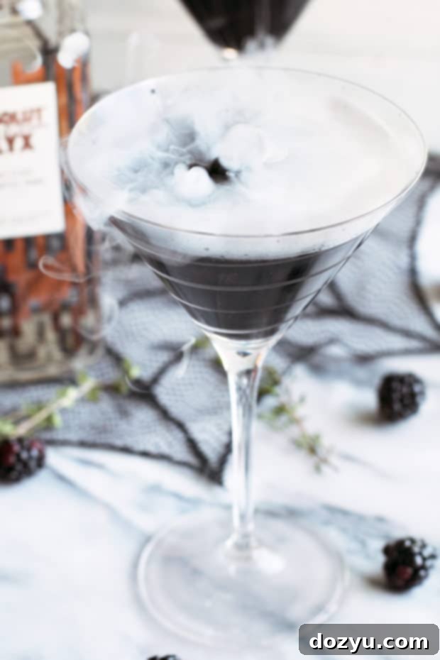 Absolut Elyx's Spellbinding Black Magic Martini 2 Absolut Elyx Black Magic Martini, a spooky and elegant Halloween cocktail featuring premium vodka, blackberry, and thyme.