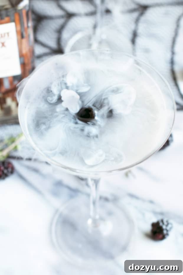 Absolut Elyx's Spellbinding Black Magic Martini 5 Dry ice effect in an Absolut Elyx Black Magic Martini, creating a spooky, misty visual.