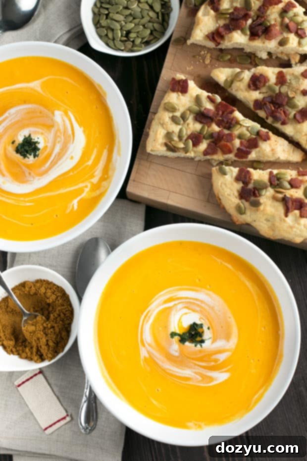 Close-up of a warm bowl of Curried Roasted Butternut Squash Soup, highlighting its rich texture and inviting aroma for a cozy fall meal.