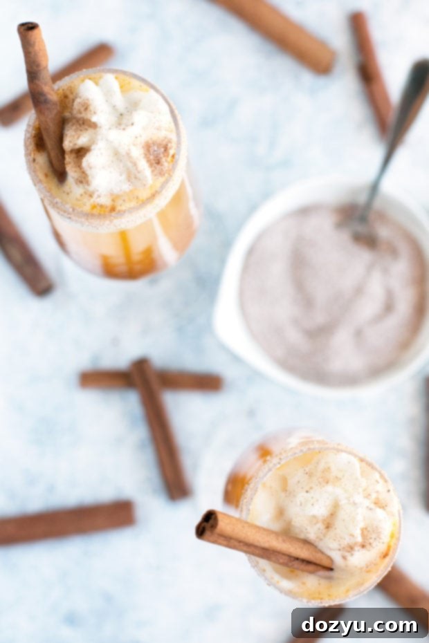 Pumpkin Spice Mimosa 6 A hand carefully rimming a champagne flute with pumpkin spice sugar for a mimosa