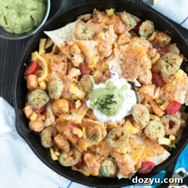 Triple Layer Chipotle Chicken Queso Nachos with Fried Jalapeños