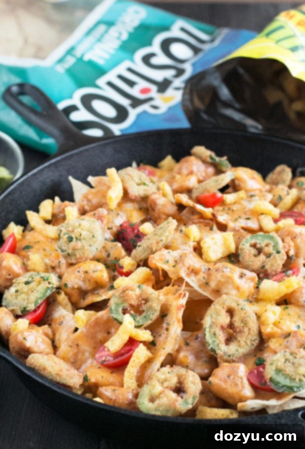 Triple Layer Chipotle Chicken Queso Nachos with Fried Jalapeños