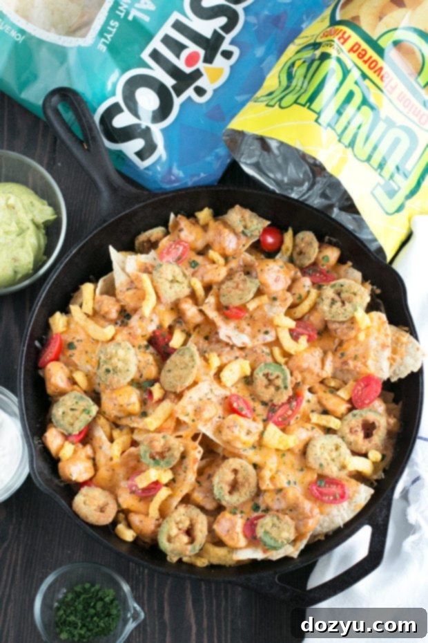 Triple Layer Chipotle Chicken Queso Nachos with Fried Jalapeños