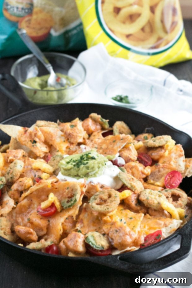 Triple Layer Chipotle Chicken Queso Nachos with Fried Jalapeños
