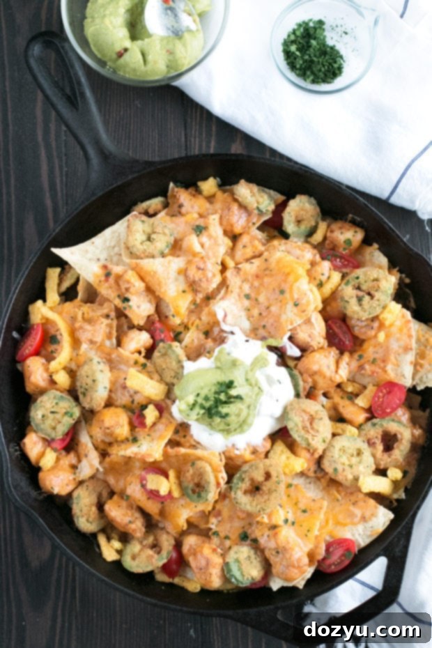 Triple Layer Chipotle Chicken Queso Nachos with Fried Jalapeños