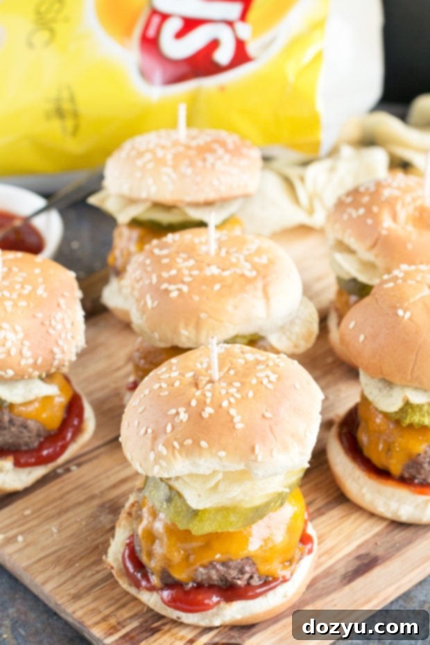 Crunch Cheeseburger Sliders - tray of sliders with chips and drinks