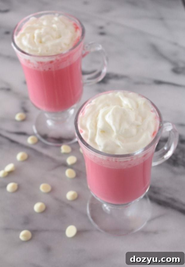 Valentine's Day Hot Chocolate 2 A close-up of pink hot chocolate topped with whipped cream.