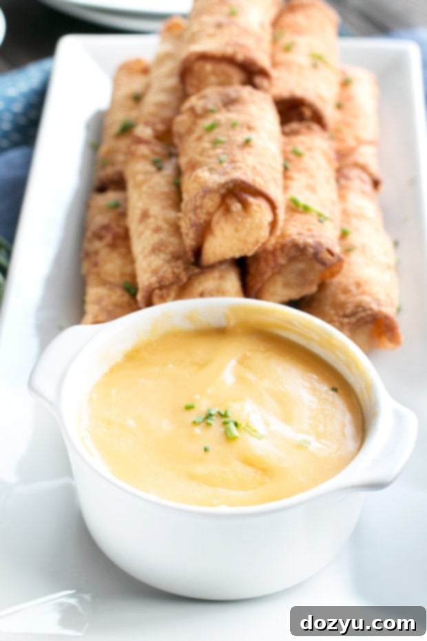 Crispy Loaded Mashed Potato Egg Rolls 3 Close up of a plate of Loaded Mashed Potato Egg Rolls, ready to be dipped