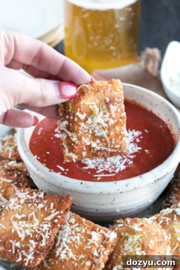 A large batch of Berbere Fried Ravioli, perfectly golden and crispy, ready to be served as an irresistible snack or appetizer