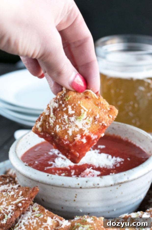 Several Berbere Fried Ravioli on a rustic serving board, ready to be enjoyed as a gourmet appetizer