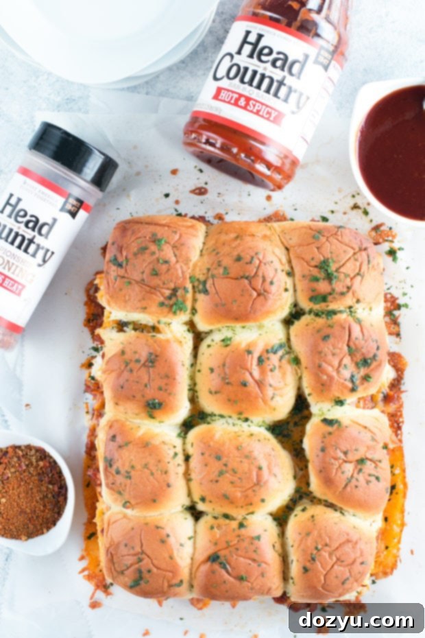 Assembly of Cheesy BBQ Chicken Pull Apart Sliders with ingredients layered