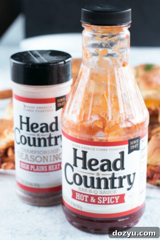 Preparing the chicken mixture for BBQ sliders in a pan