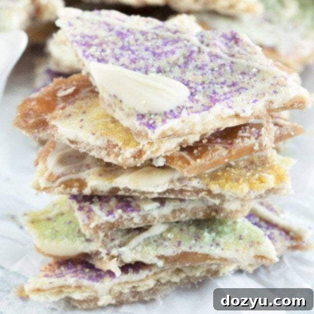 Mardi Gras King Cake Brittle 8 King Cake Crack Candy with white chocolate and festive sprinkles.