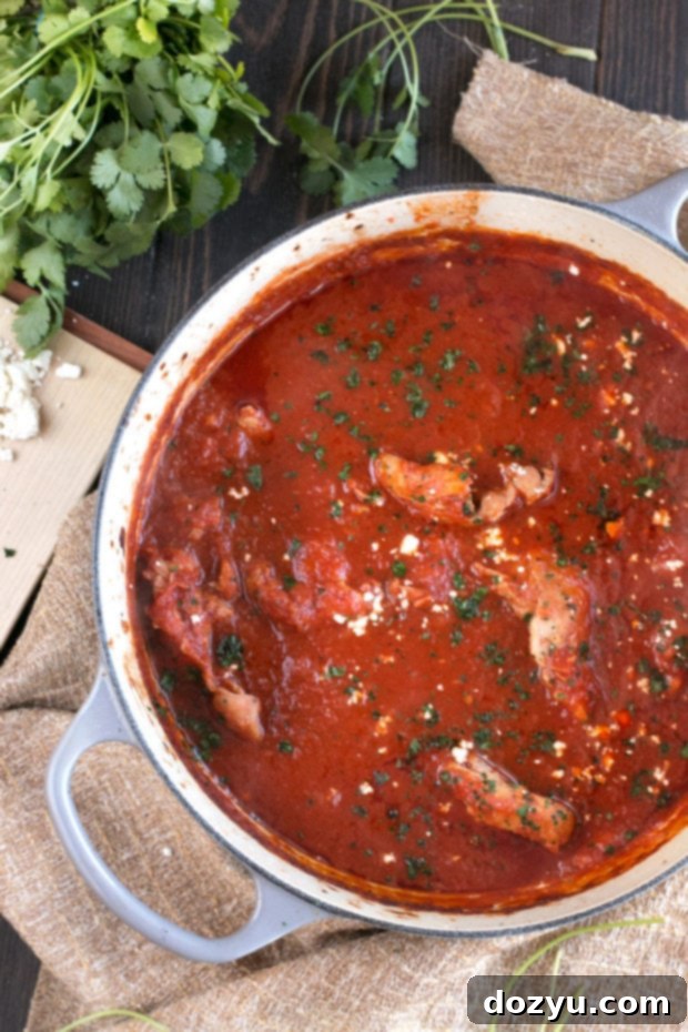 Delicious Chipotle Braised Chicken Thighs in a Dutch oven, ready to be served.