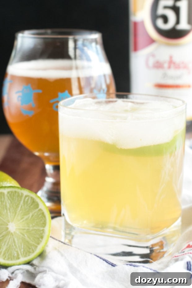 Refreshing IPA Caipirinha cocktail with lime garnish