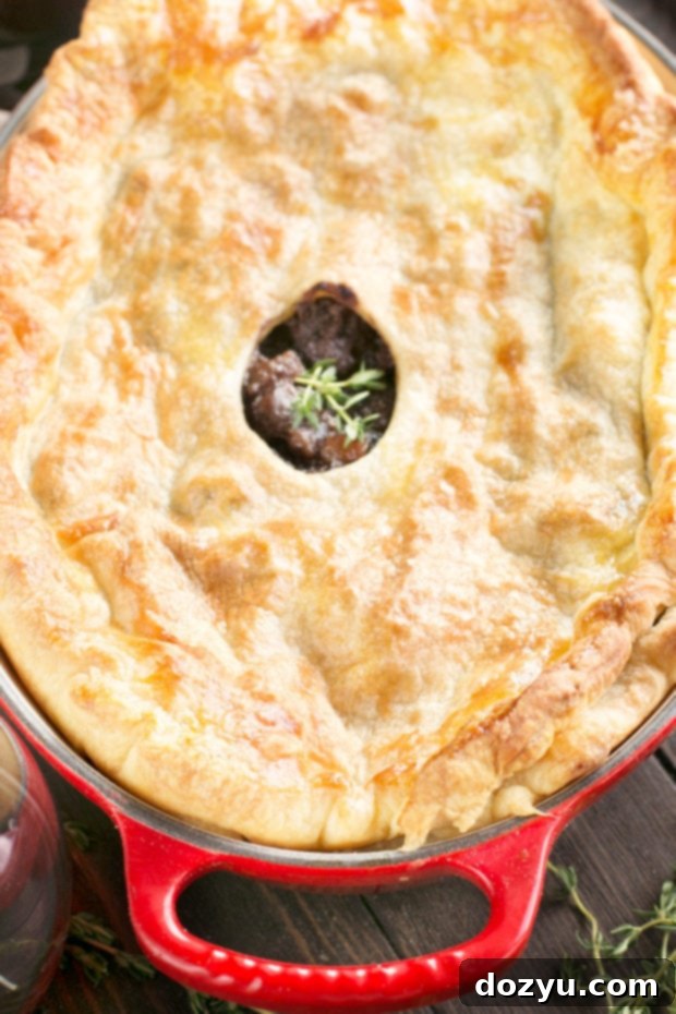 Burgundy Beef Comfort Pie 3 Close-up of the rich beef stew filling inside a Boeuf Bourguignon Pot Pie