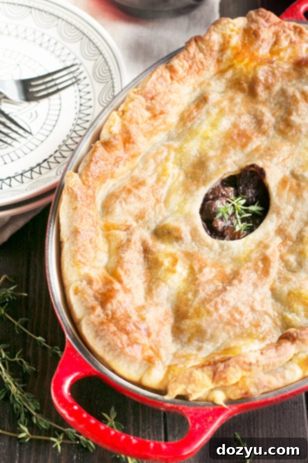 Burgundy Beef Comfort Pie 6 A whole Boeuf Bourguignon Pot Pie on a serving board