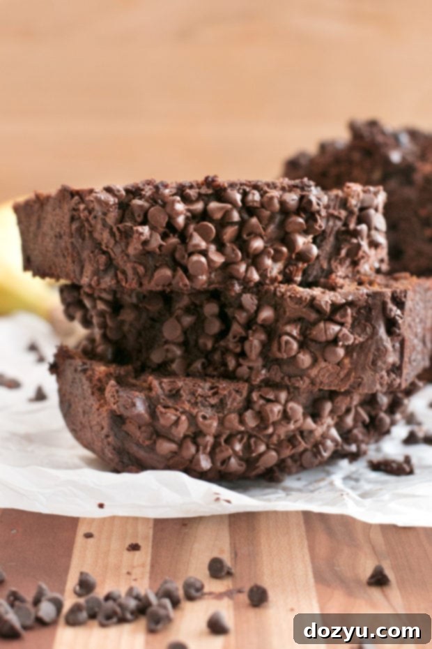 Side view of Double Chocolate Avocado Banana Bread, highlighting its height and crust